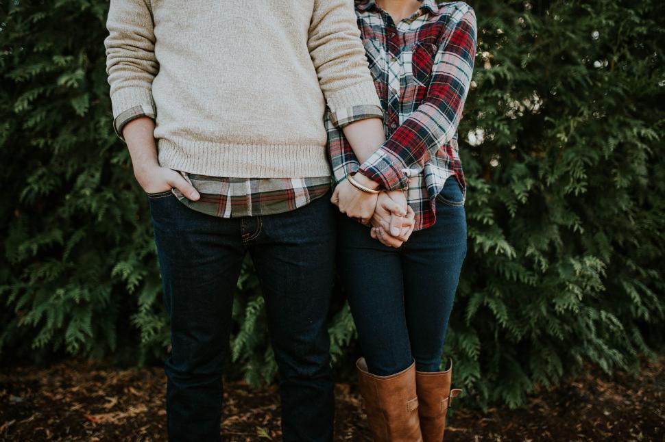 Free Image of A Man and a Woman Standing Next to Each Other 