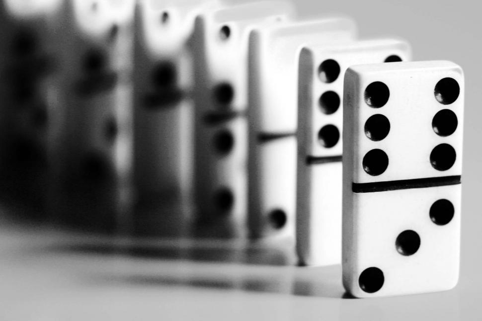 Free Image of dominos games sequence chain reaction falling precarious dots standing black and white 
