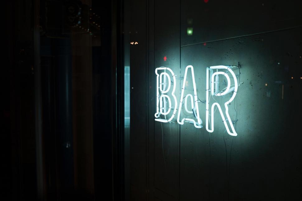 Free Image of Neon Sign That Reads RAB on a Wall 