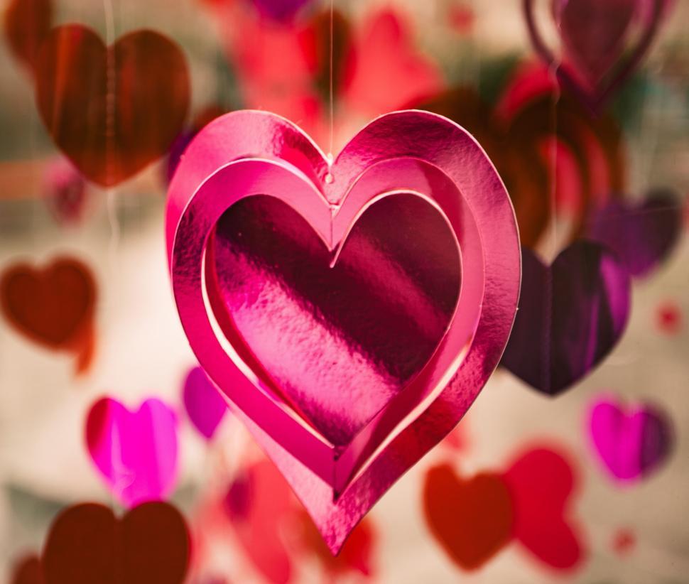 Free Image of Pink Heart Hanging From String 