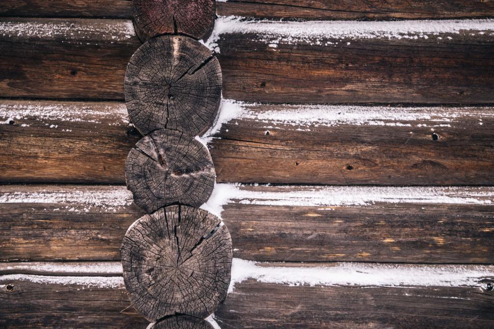 Free Image of Close Up of Snow Covered Log Wall 