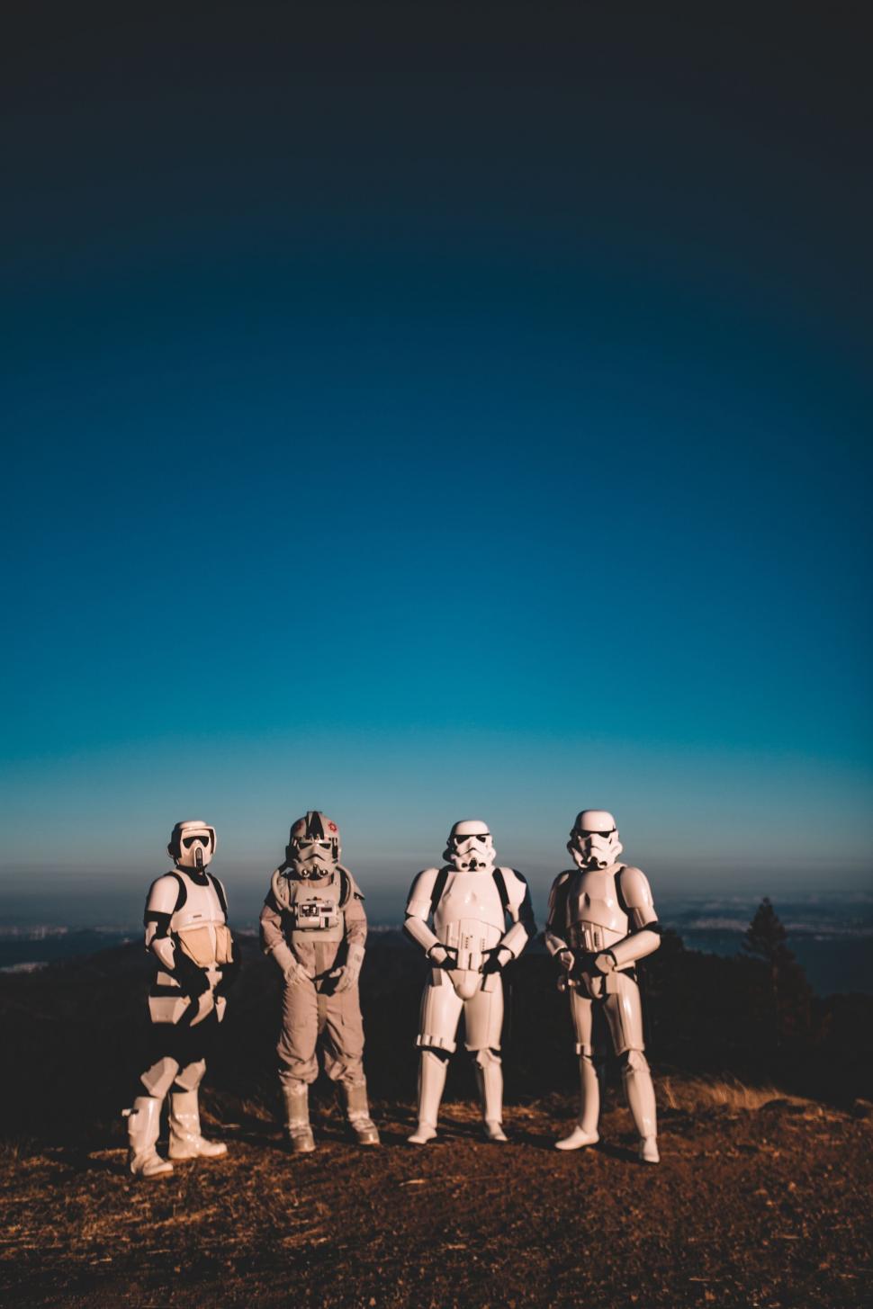 Free Image of Group of Star Wars Figures Standing on Top of Hill 