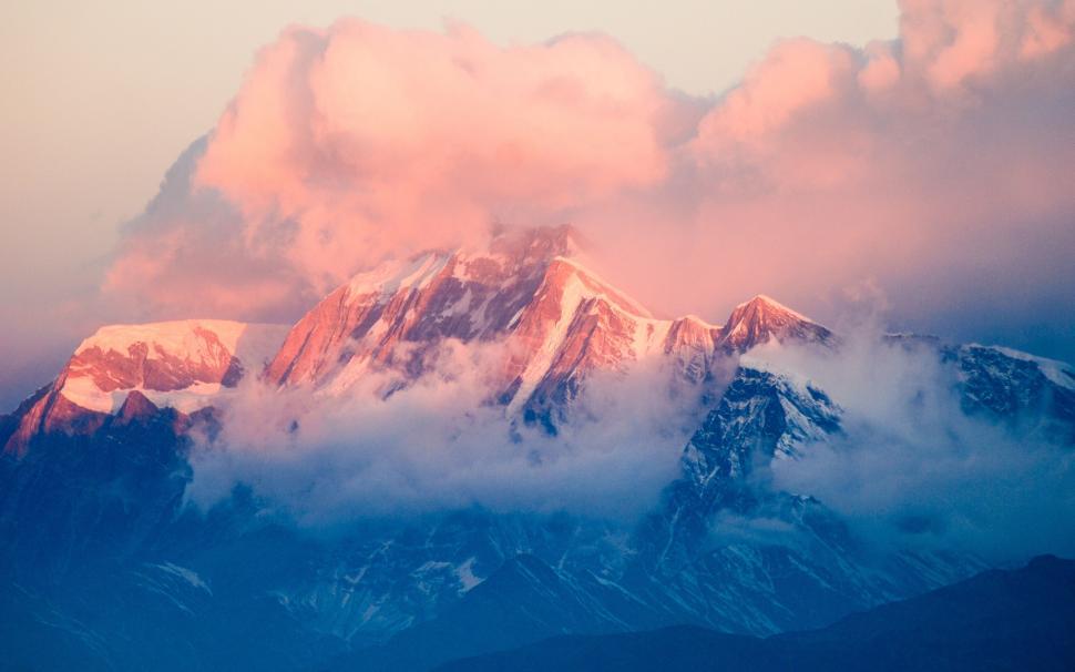 Free Image of Snow-Covered Mountain Beneath Cloudy Sky 