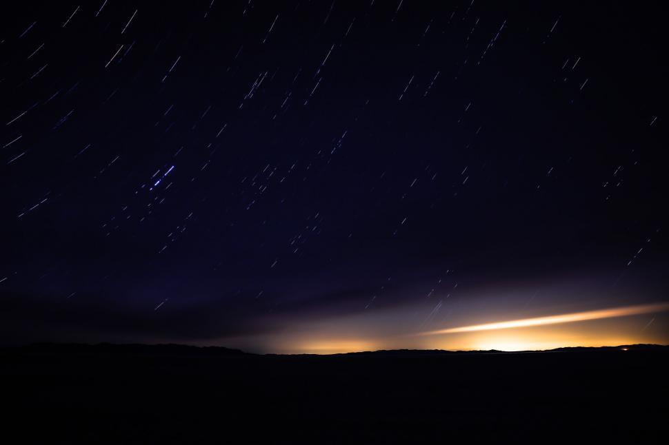 Free Image of Night Sky With Stars Above a Hill 