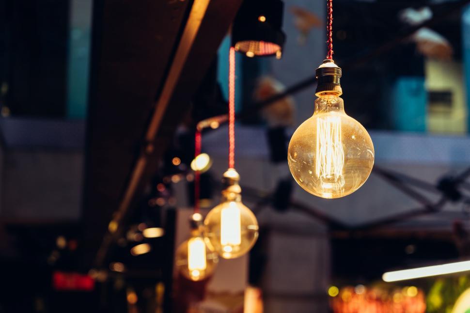 Free Image of Group of Light Bulbs Hanging From Ceiling 