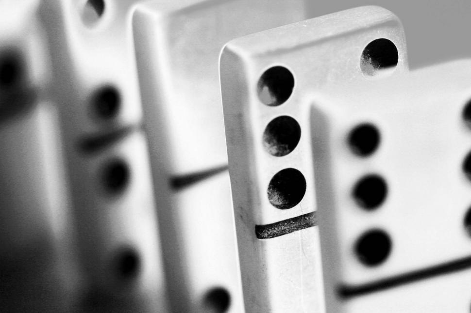 Free Image of dominos games sequence chain reaction falling precarious dots standing black and white 