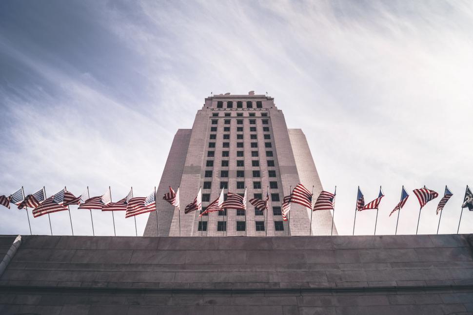 Free Image of Tall Building With American Flags Flying 