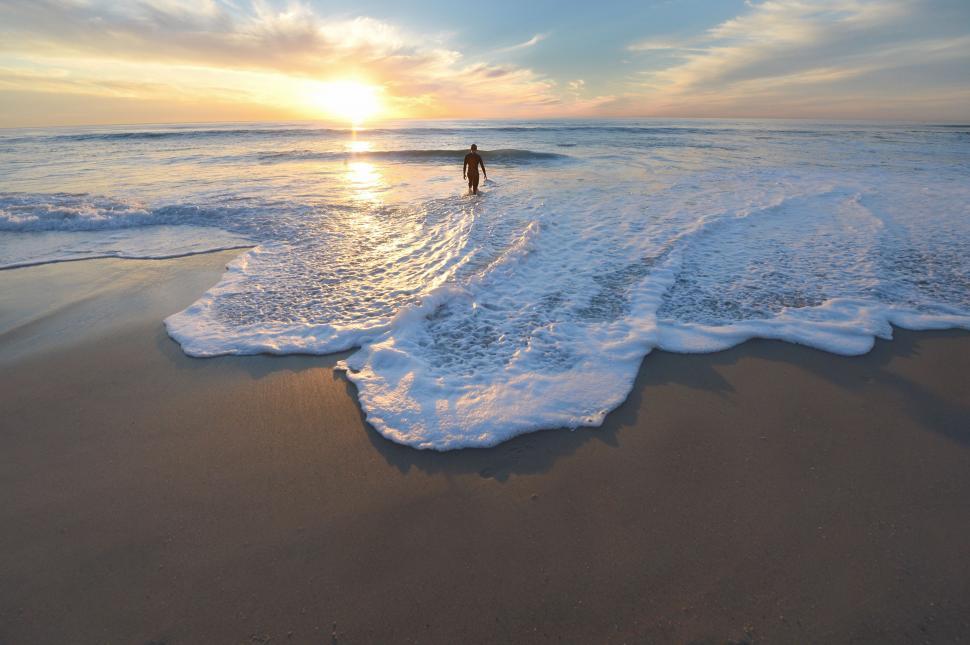 Free Image of Person Standing in Surf at Beach 