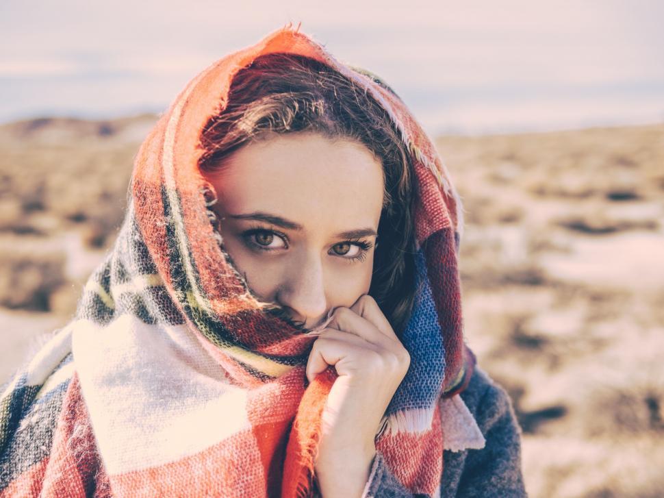 Free Image of Woman Wearing a Scarf Around Her Neck 