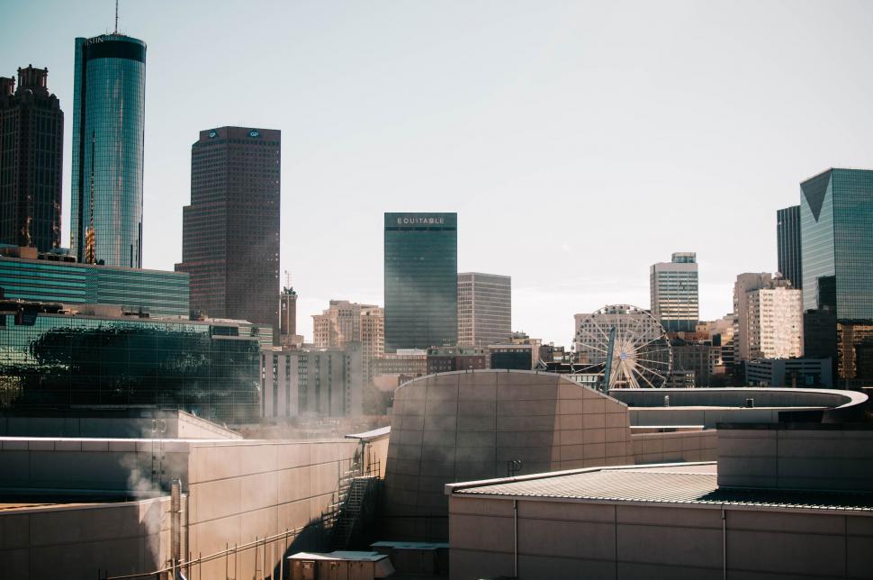 Free Image of Urban City Skyline With Tall Buildings and Smoke 