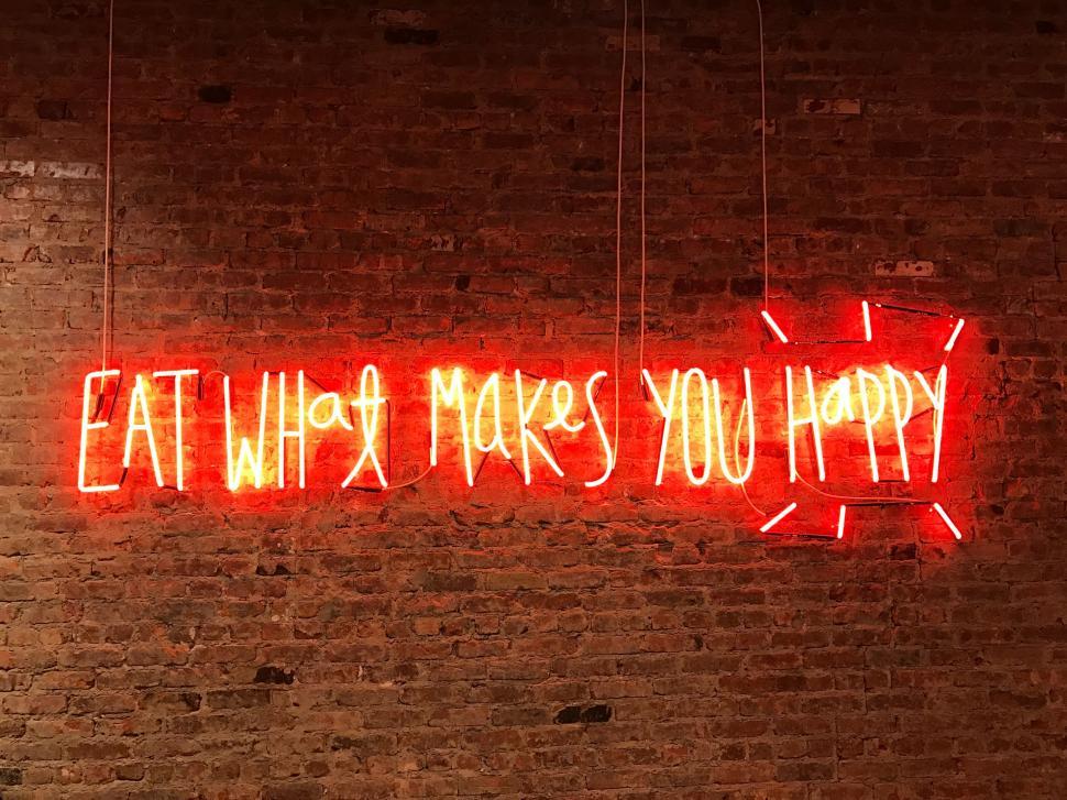 Free Image of Neon Sign Saying Eat What Makes You Happy 