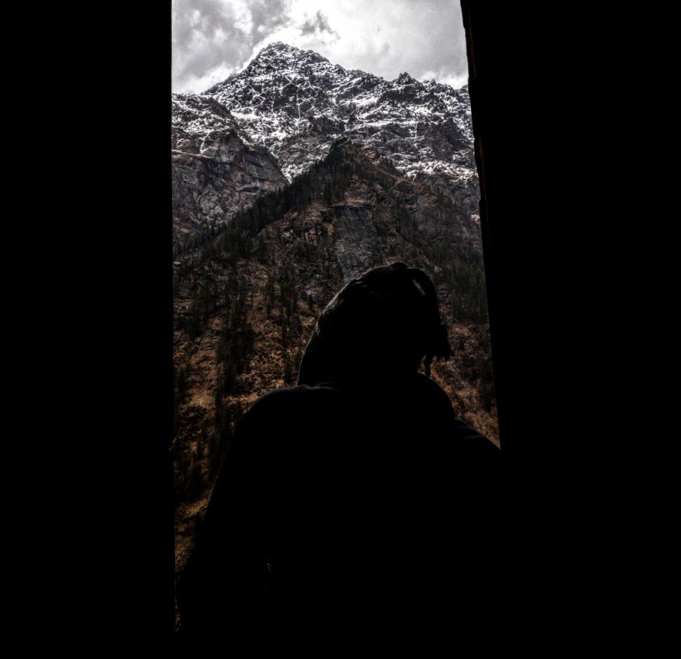 Free Image of Person Standing in Front of Mountain 