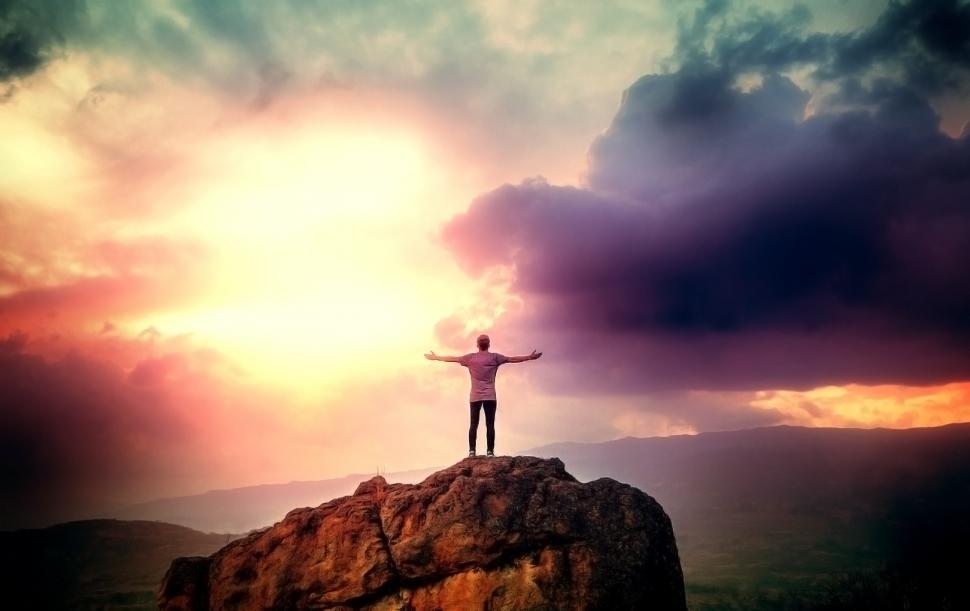 Download Free Stock Photo of Man on the Summit Embracing a Brave New Day 