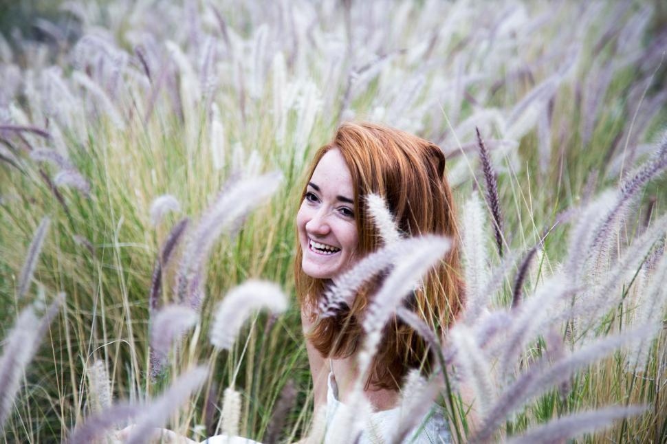 Free Image of Woman Sitting in Tall Grass Field 