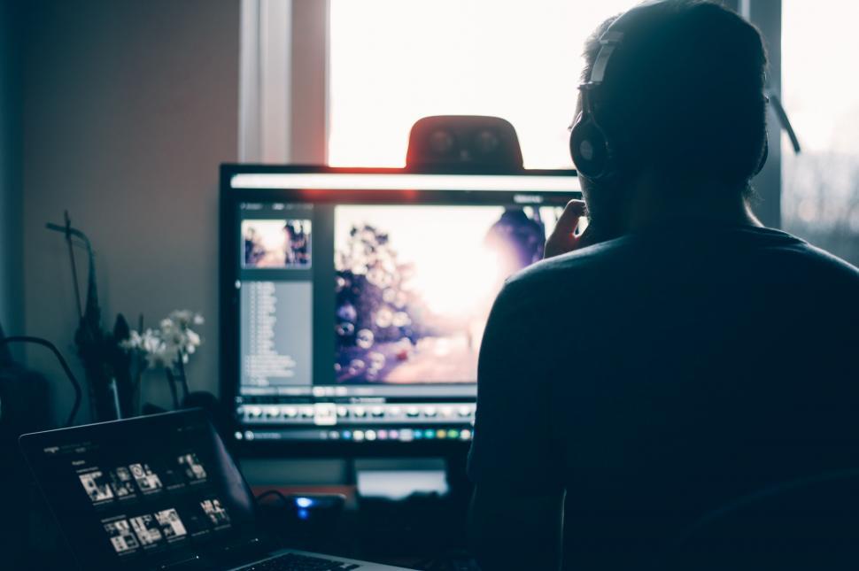 Free Image of Person Sitting in Front of Computer Monitor 