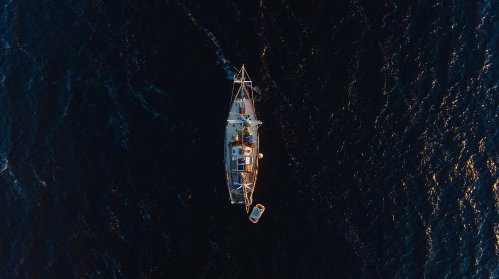 Free Image of Small Boat Adrift in Open Ocean 