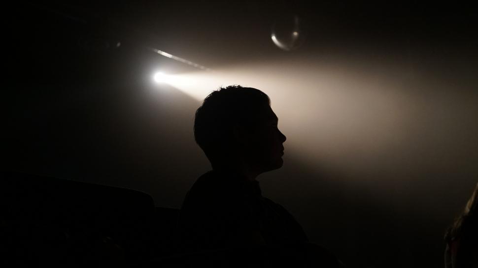 Free Image of Person Standing Alone in Darkness 