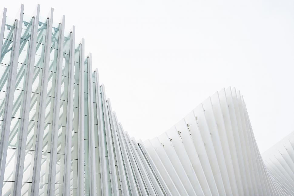 Free Image of Tall White Building With Long Metal Structure 