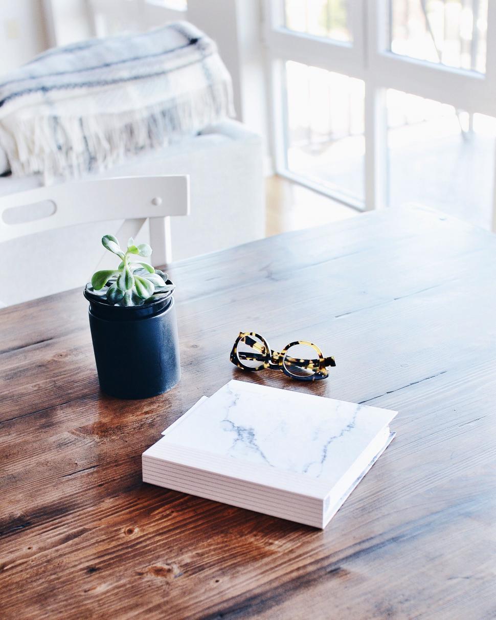 Free Image of Sunglasses Resting on Wooden Table 
