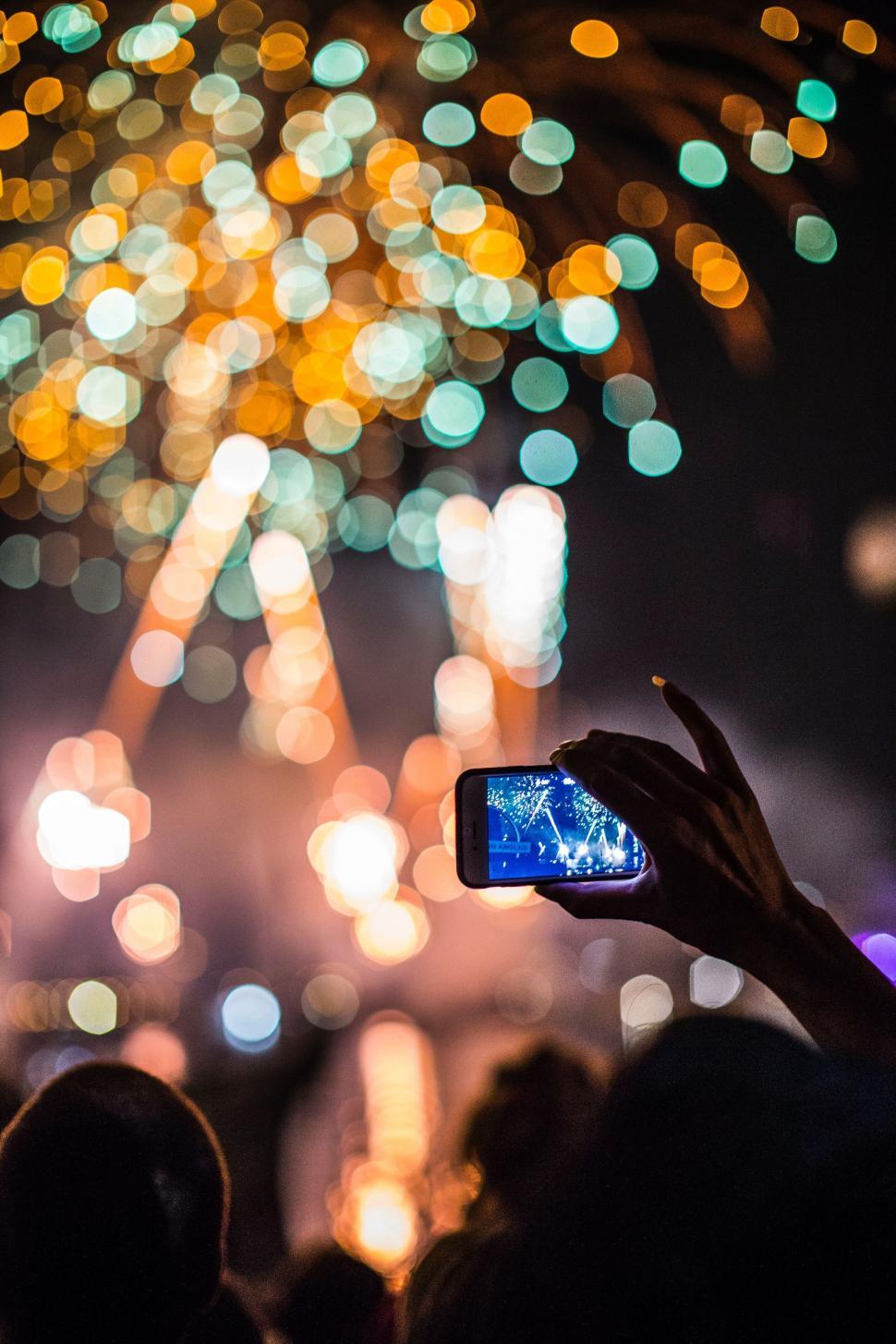 Free Image of Person Capturing Fireworks Display With Camera 