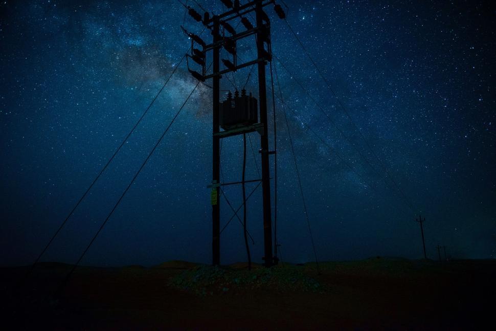Free Image of Telephone Pole Under Starry Sky 