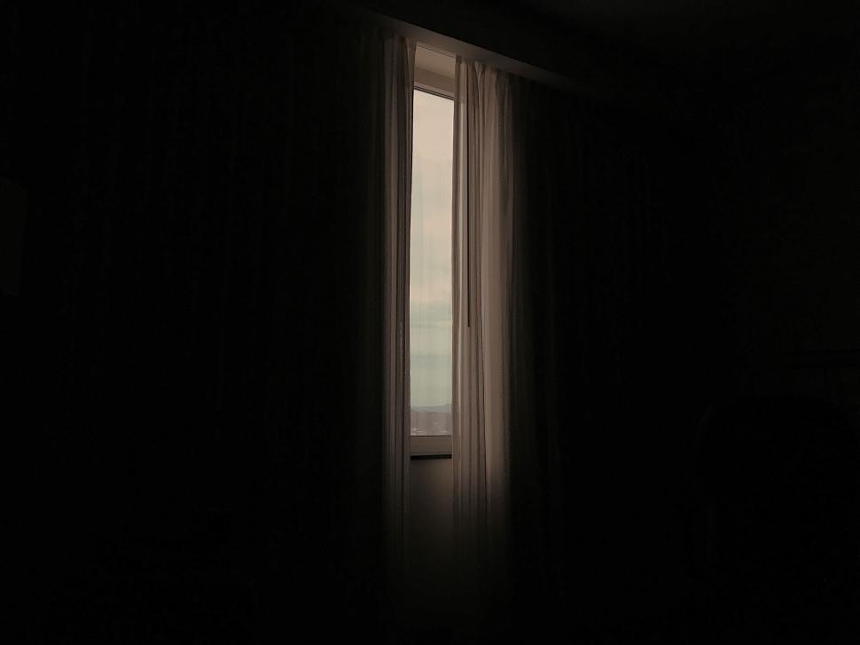 Free Image of Dark Room With Window and Curtain 