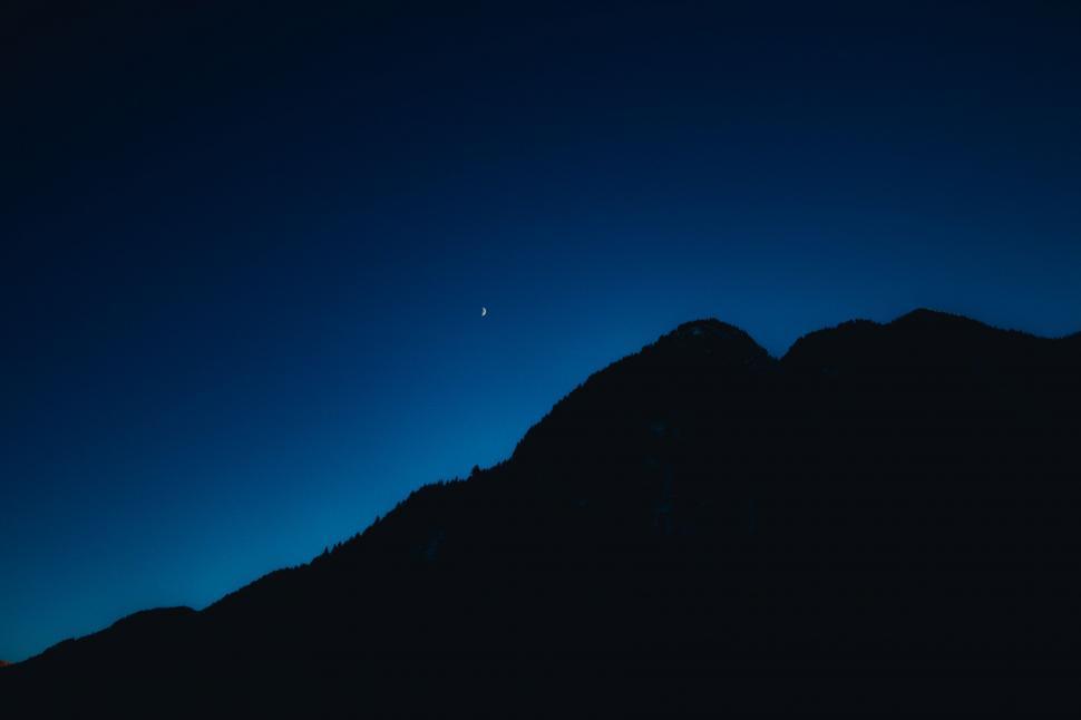 Free Image of Dark Blue Sky With Mountain in Background 