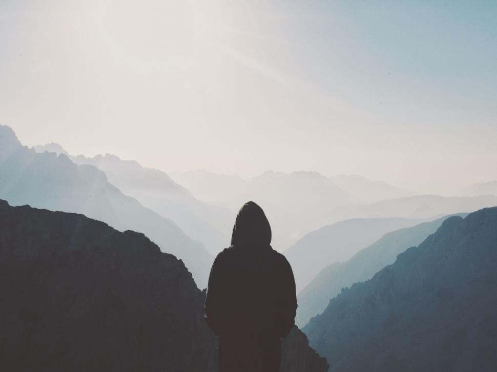 Free Image of Person Standing at the Top of a Mountain 