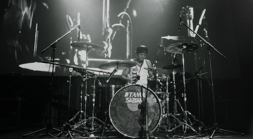 Free Image of Man Playing Drums on Stage 
