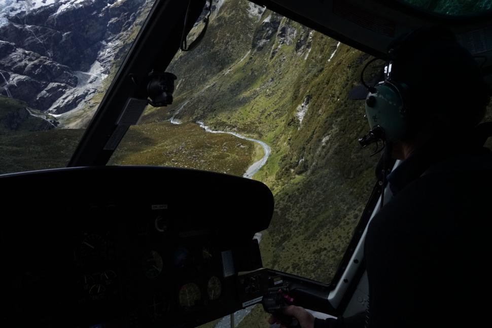 Free Image of Man Sitting in Helicopter Looking Out the Window 