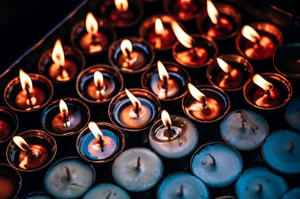 Free Image of A Bunch of Lit Candles on a Table 