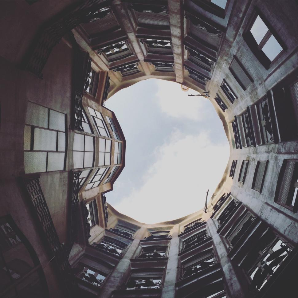 Free Image of Looking Up at the Sky From Inside Building 