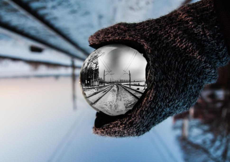 Free Image of Hand Holding Ball Reflection 