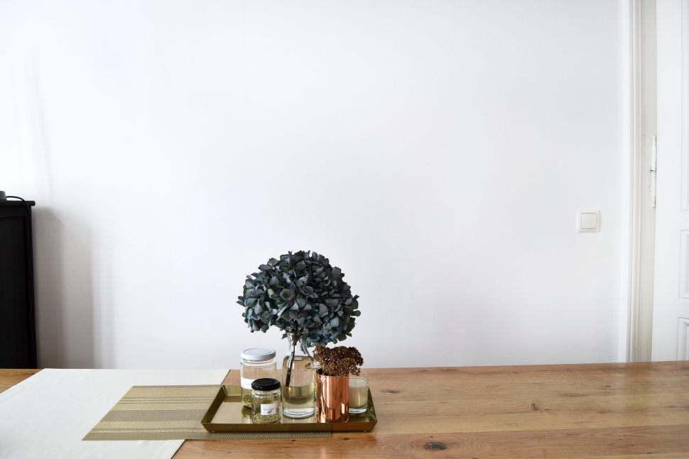 Free Image of Wooden Table With Vase of Flowers 
