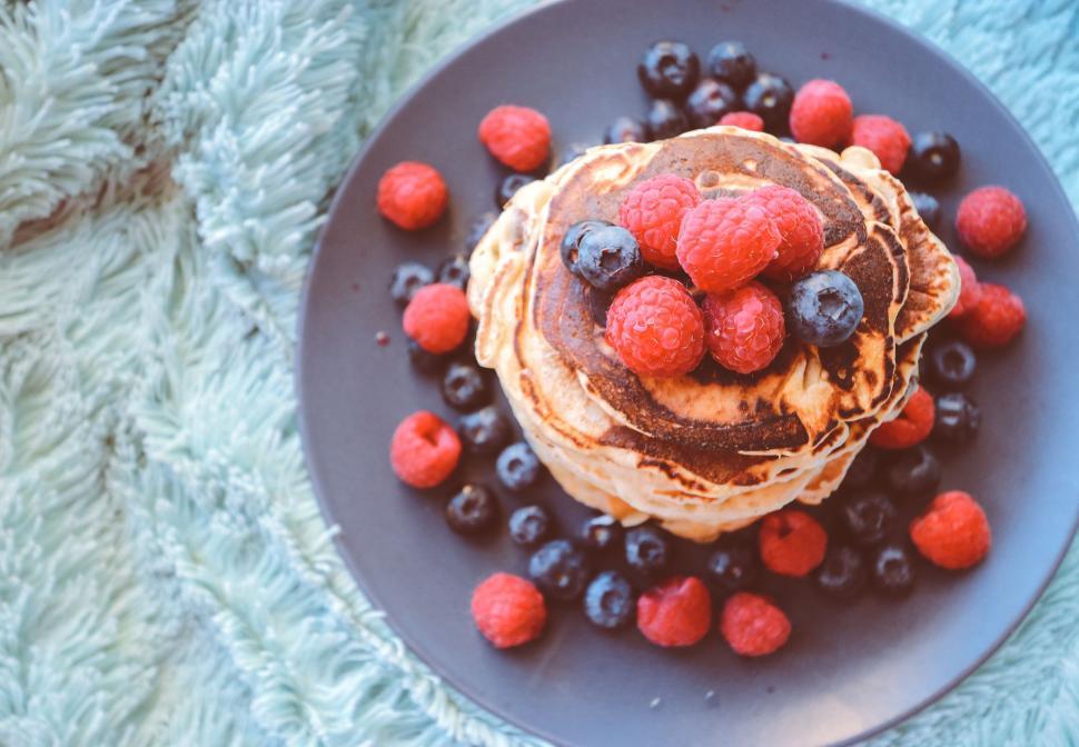 Free Image of Stack of Pancakes With Berries and Blueberries on a Plate 