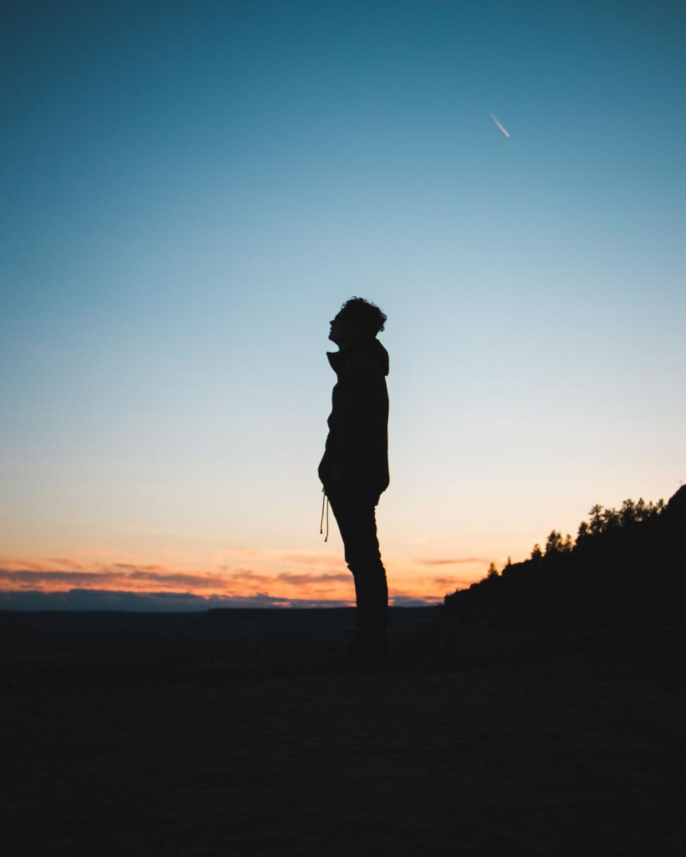 Free Image of Silhouette of Person Standing on Hill 