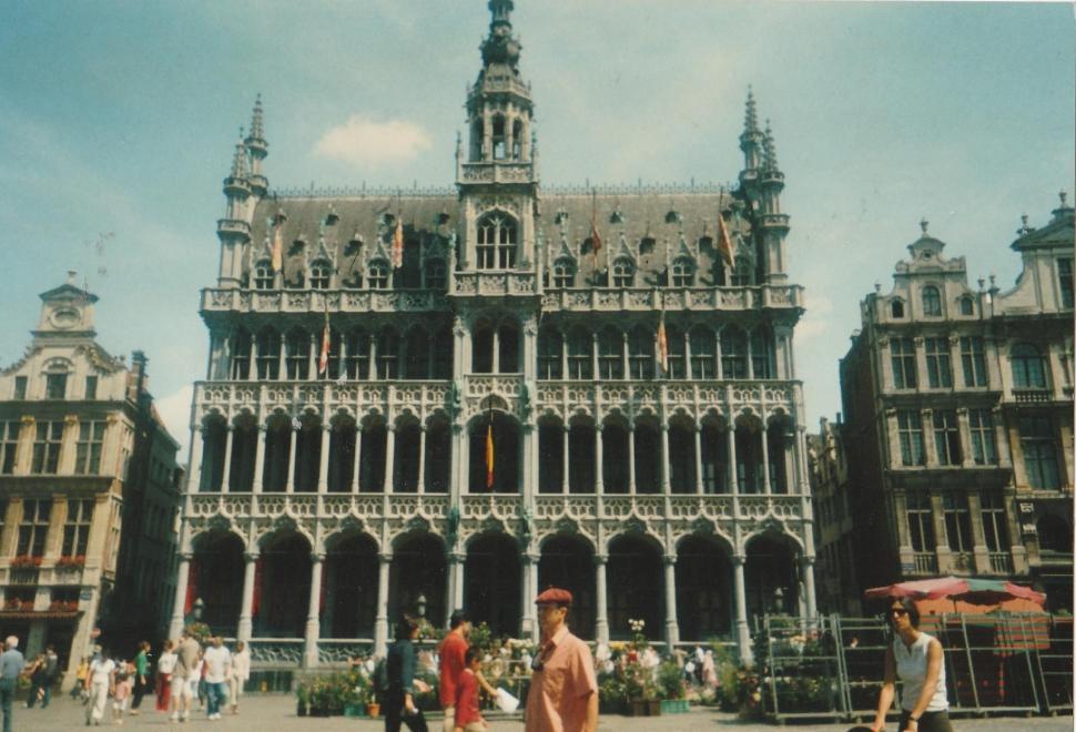 Free Image of Group of People Standing in Front of a Large Building 