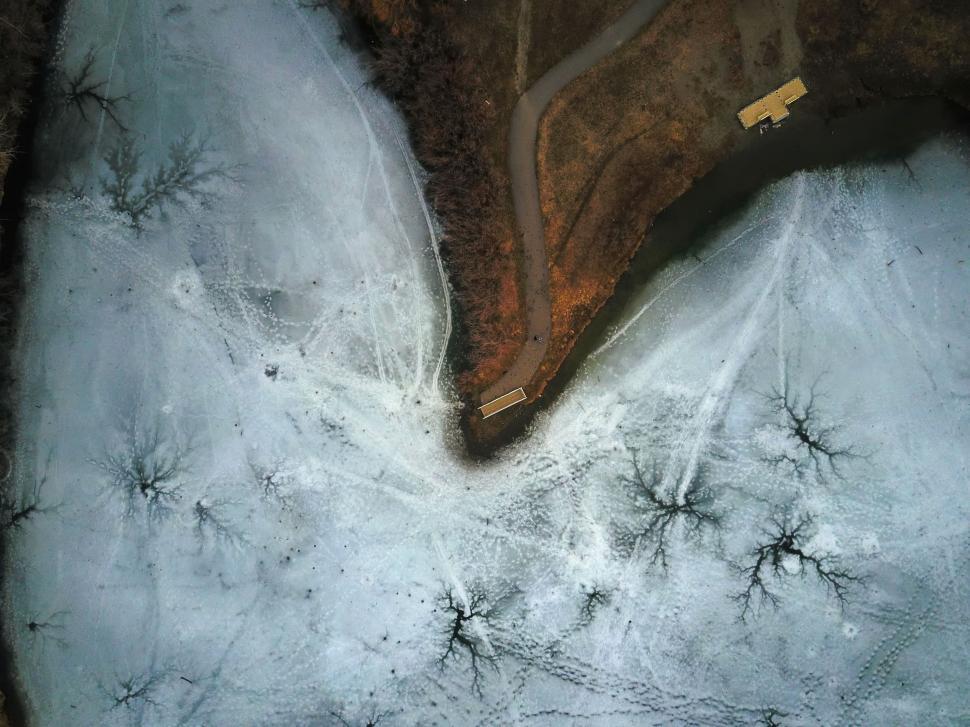 Free Image of Aerial View of Snow Covered Field 