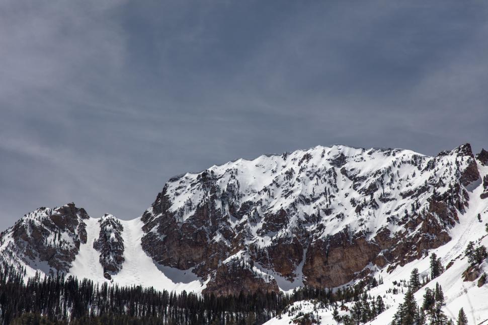 Free Image of Snow-Covered Mountain With Side Trees 