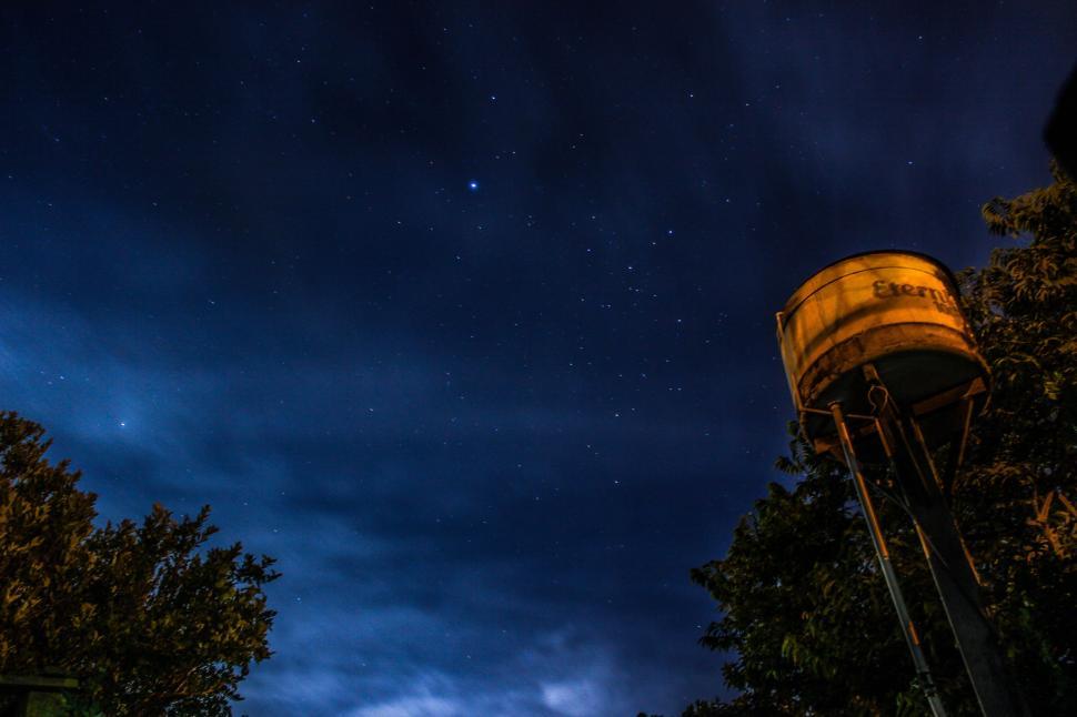 Free Image of Tower and Trees Under Night Sky 