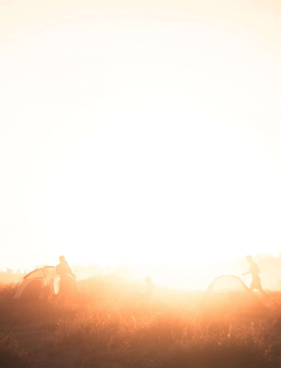 Free Image of Group of People Riding Horses Across Field 