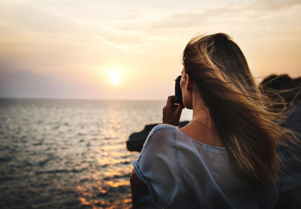Free Image of Woman Talking on Cell Phone Near Ocean 