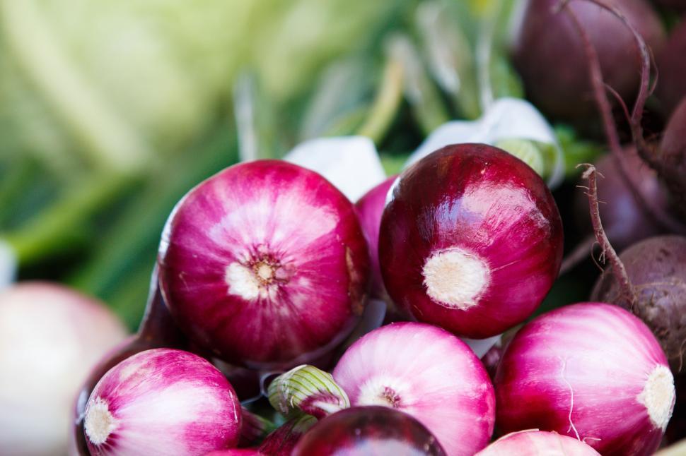Free Image of Pile of Red Onions on Table 
