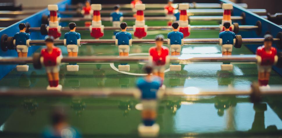 Free Image of Close Up of a Foosball Table With Many Small Figurines 