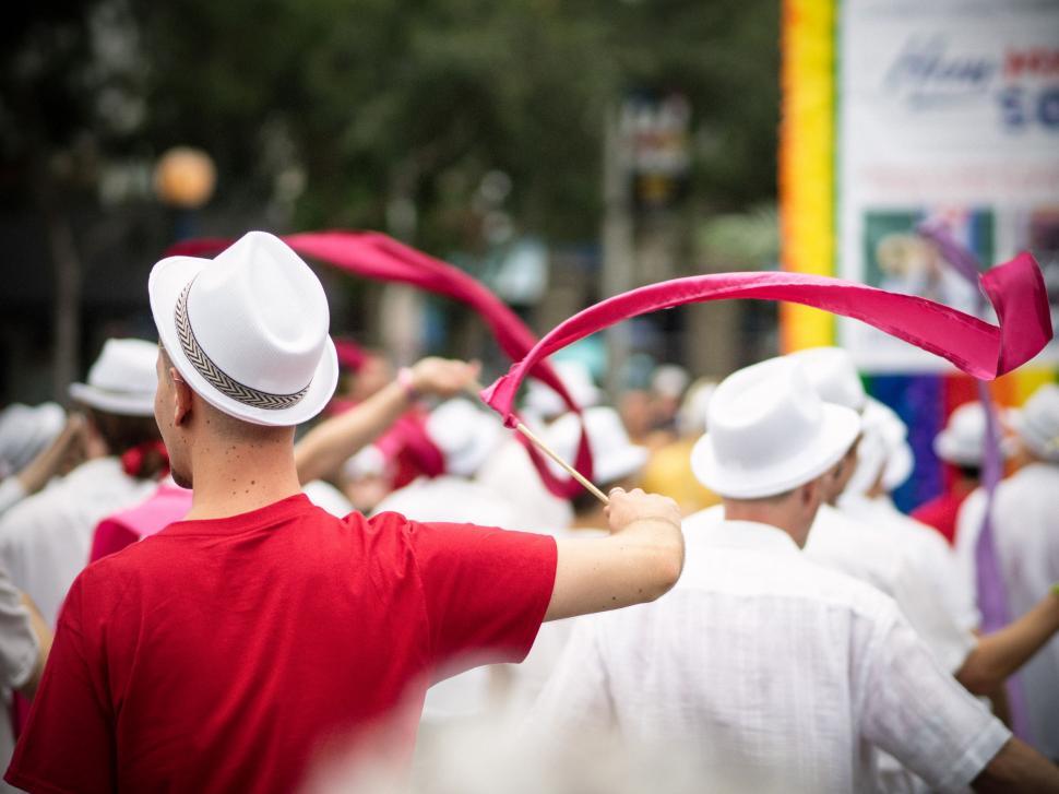 Free Image of Group of People Wearing White Hats and Red Shirts 