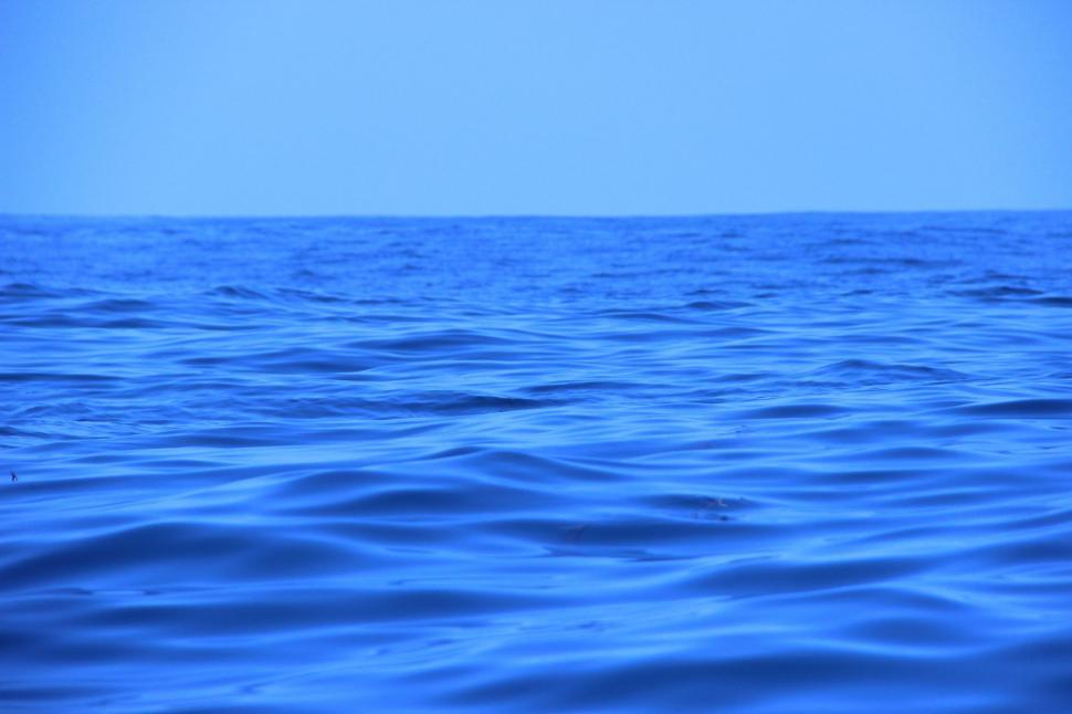 Free Image of Vast Body of Water Under Blue Sky 