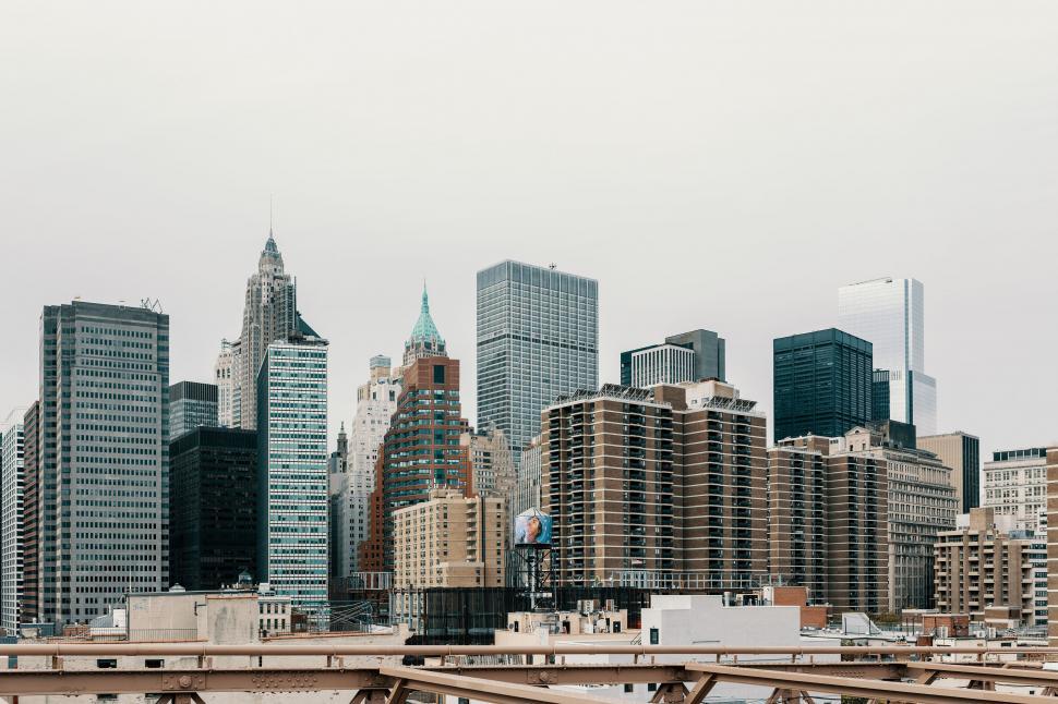 Free Image of City Skyline With Tall Buildings and Bridge 