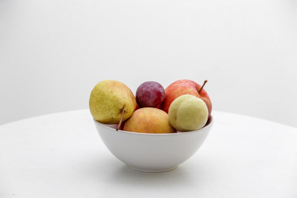 Free Image of White Bowl Filled With Fruit on Table 