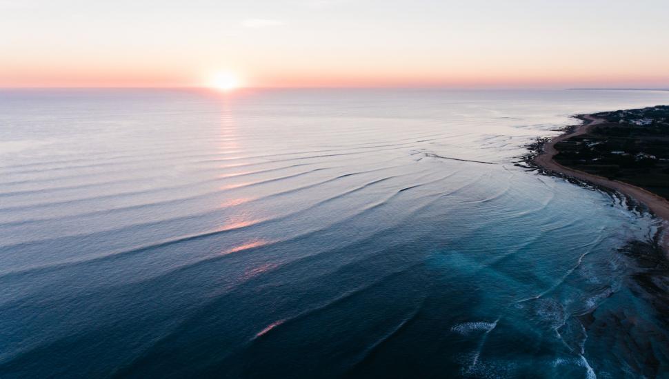 Free Image of Aerial View of the Ocean at Sunset 