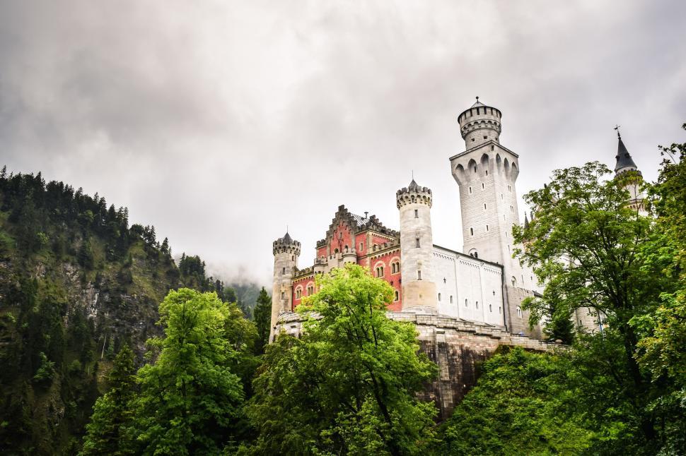 Free Image of Castle Tower Surrounded by Trees 